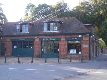 Slade's Garage is prominently located on the corner of Church Road and Beacon Hill, approximately 200 yards from the Village Centre and Green which provides local amenities for food and drink. The towns of Beaconsfield, Amersham and High Wycombe are...
