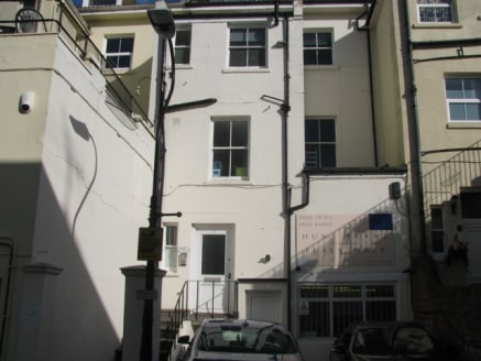 The premises are accessed via some steps leading to an entrance door with a downstairs WC. Further stairs lead to a mezzanine office with a small sink area, then there are stairs leading to the first floor which is divided into two offices.