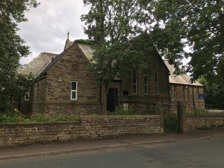 The property comprises a single storey building (with cellar), of coursed sandstone construction, beneath a number of steeply pitched and hipped slate roofs, incorporating rooflights, and supported on timber trusses. The building has a small octagona...