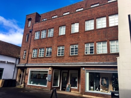 The property comprises 2 ground floor retail units and 3 residential floors above.

The residential floors are split to provide 4 studio apartments on each floor - 12 in total. 

There is parking and further land at the rear which fronts the Kennet a...