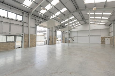 DESCRIPTION:\n\nUnit 5 is an attractive mid terrace industrial/warehouse unit of steel portal frame construction with block/metal clad elevations under an insulated roof. The property benefits from three phase power, high bay lighting an electronic a...