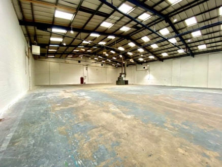 The property comprises a mid terraced industrial / warehouse unit constructed of a steel frame with brick and profile clad elevations and pitched roof.

Internally the bulk of the space is clear open plan with ground and first floor offices to the fr...