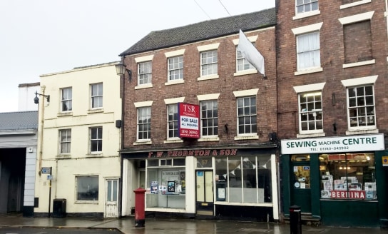 This attractive Grade II listed retail building of traditional brick construction provides extensive accommodation arranged over four floors extending in total to approx. 7,000 sqft (650.32sqm) including basement storage.

The property is in need of...