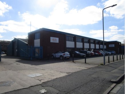 The property comprises a detached industrial unit, incorporating workshop and stores to the rear, with two storey offices and despatch bay the front and adjacent car parking. The offices are of two storey brick clad construction under a flat roof, wi...