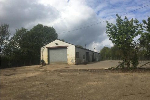 Secure 1.15acre surfaced yard including workshop accommodation with visibility from A14. The workshop is divided into 4 sections and benefits from roller shutter access, 3-phase power supply, offices, kitchen and WCs. The property is available by way...