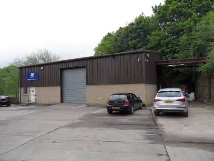 The property comprises a modern detached steel portal framed industrial unit which is constructed from a combination of stone and profiled metal sheet cladding to the front and side elevations and is surmounted by a dual pitched roof which has a prof...
