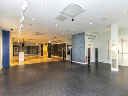 The property benefits from a ground floor entrance lobby and display window with stair and a disabled lift providing access to a well-fitted first floor open plan sales area with rears staff and storage areas and storage on the second floor.

The pro...