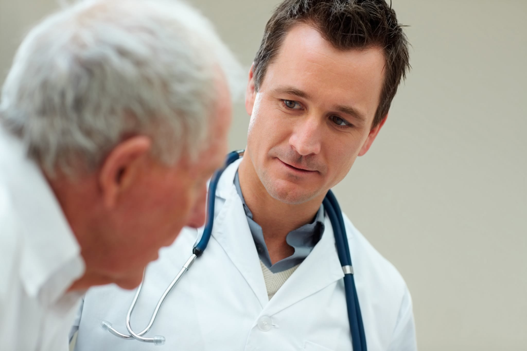 Male Doctor with Older Male Patient