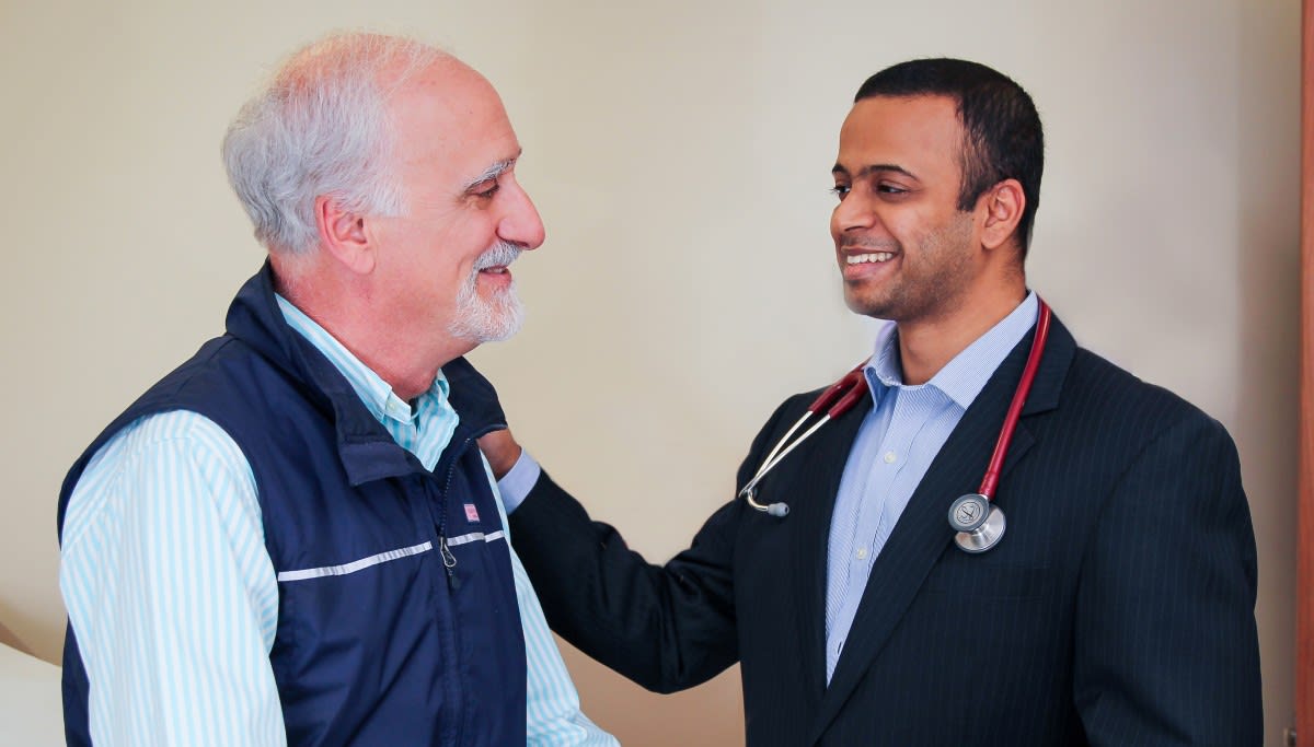 Pain Management - Dr. Kal Kalava with a patient