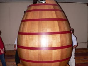 Large egg-shaped oak vat inside a Bordeaux winery cellar