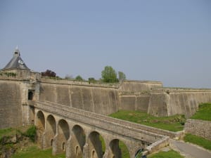 Stone ramparts and arched bridge leading into the historic citadel in Blaye, France