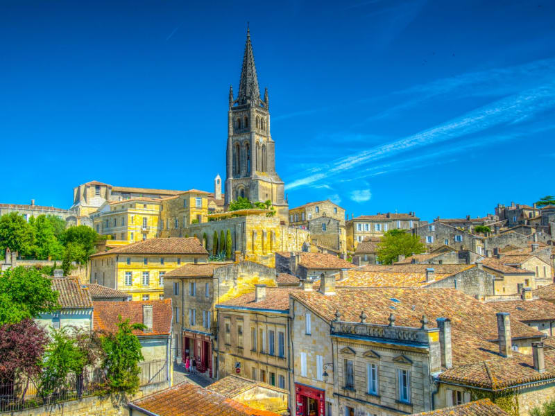 Panoramic view of the UNESCO-listed medieval village of Saint-Émilion with its limestone church tower and surrounding vineyards