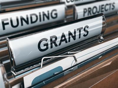 File folders saying grants, funding, projects