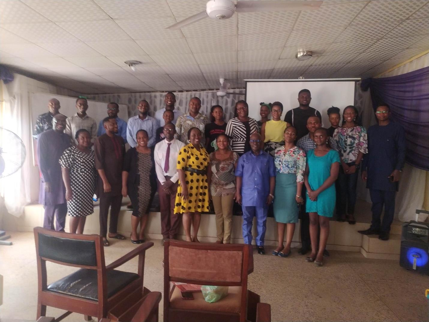 Twenty three participants and the instructors pose for a photo at the workshop focused on