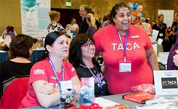 Members of Talking About Curing Autism talk to meeting attendees at the Expo session