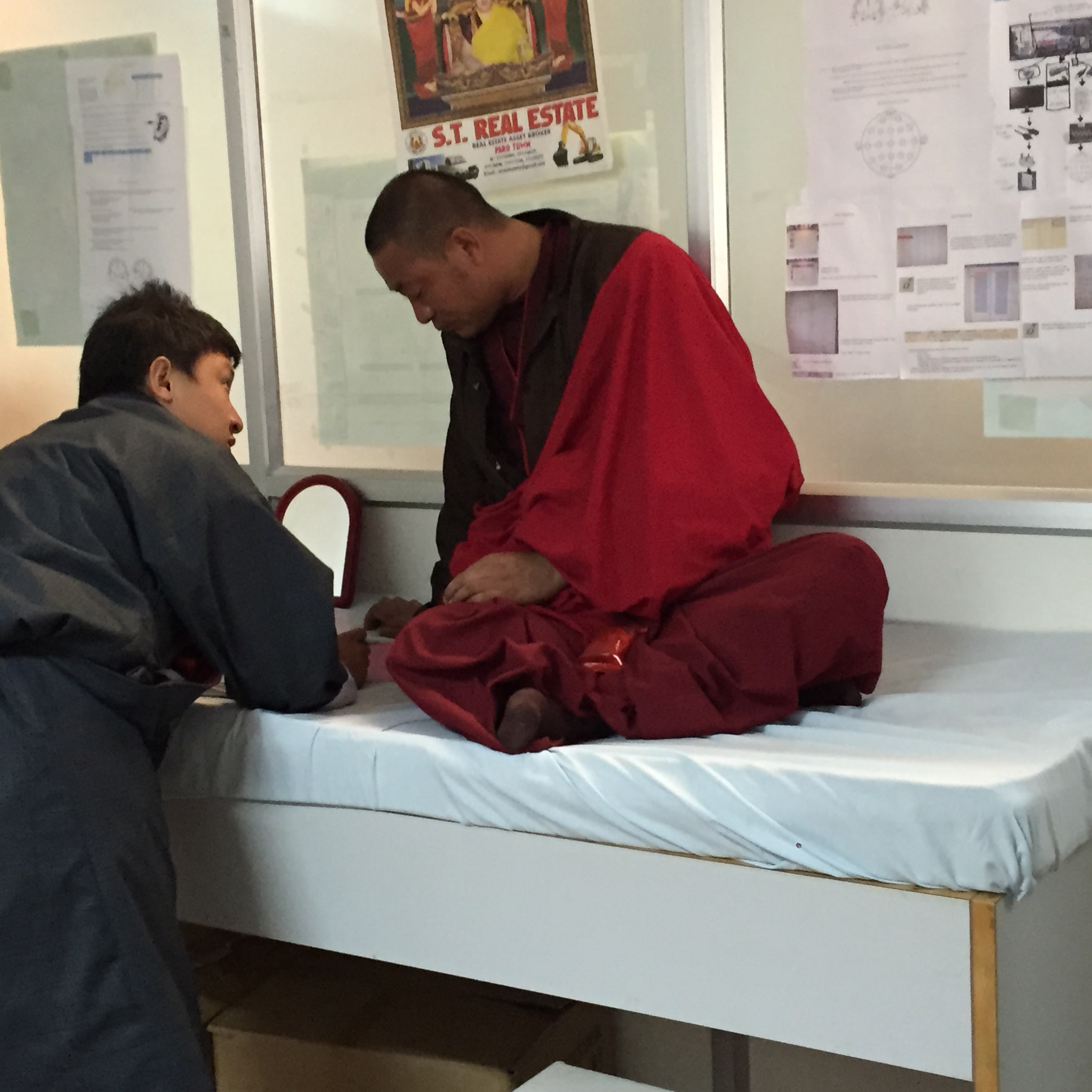 Figure 3. Lhab Tshering, Research Coordinator, Bhutan Epilepsy Project, interviews a monk who is participating in the project.