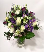 Round bouquet of white and purple colors