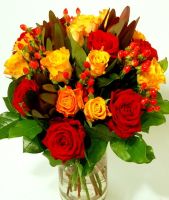 Round bouquet of red and orange roses and appendices