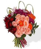 A bouquet of red, pink and orange roses