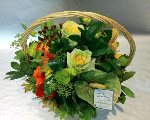 Flower arrangement in basket  orange colors Magic delight