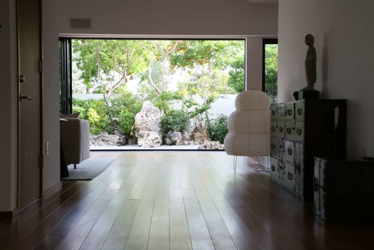 view of garden through doorway at Grand Cayman residence