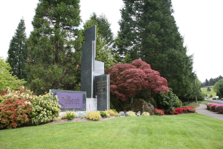 The Quintet sign with trees