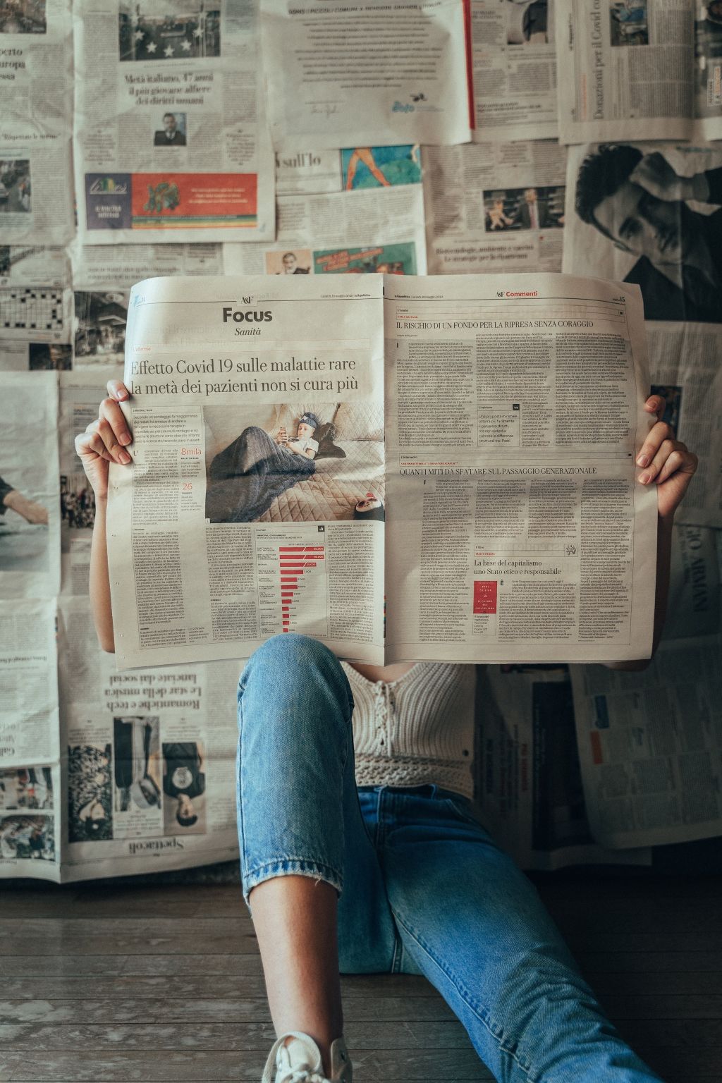 Photo of a woman reading a newspaper