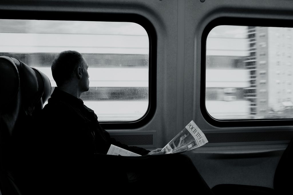 Photo of a man reading a newspaper