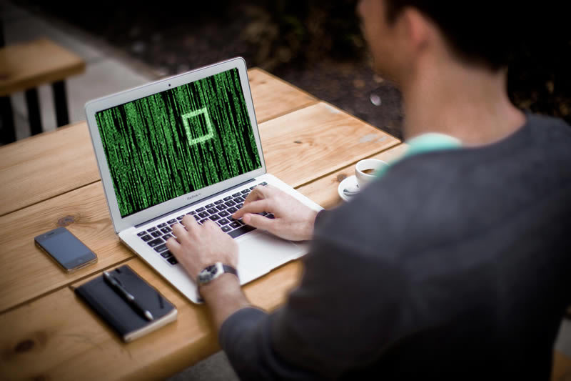 cyber man on laptop