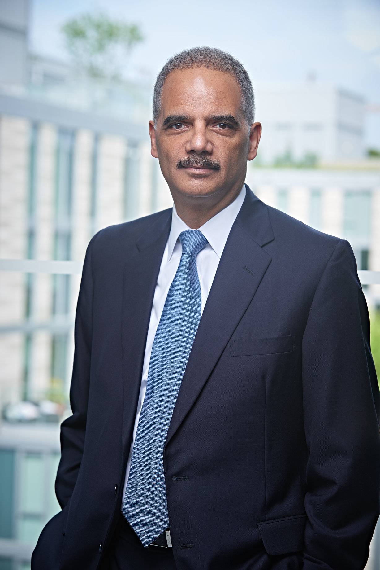Holder rejects criticisms of waivers for banks that plead guilty