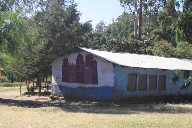 A mural of Gondar castle at Arbatu Ensesa School. This mud and wood structure with corrugated iron roof is a typical classroom design at government schools that I have seen in the North and the South. Link Ethiopia funded the metal shutters and doors to improve security and added cement flooring replacing mud and dust (which had made some children ill).
