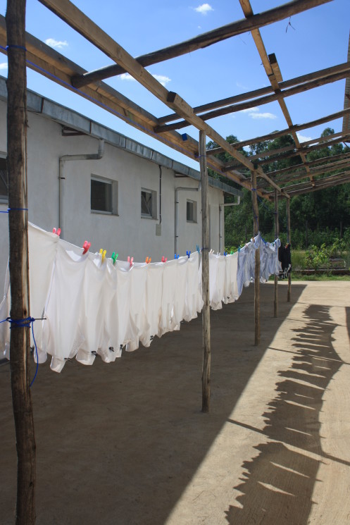 School uniforms hanging out to dry at St. George’s. The school provides uniforms and materials as priority is given to orphans and children from poor families.