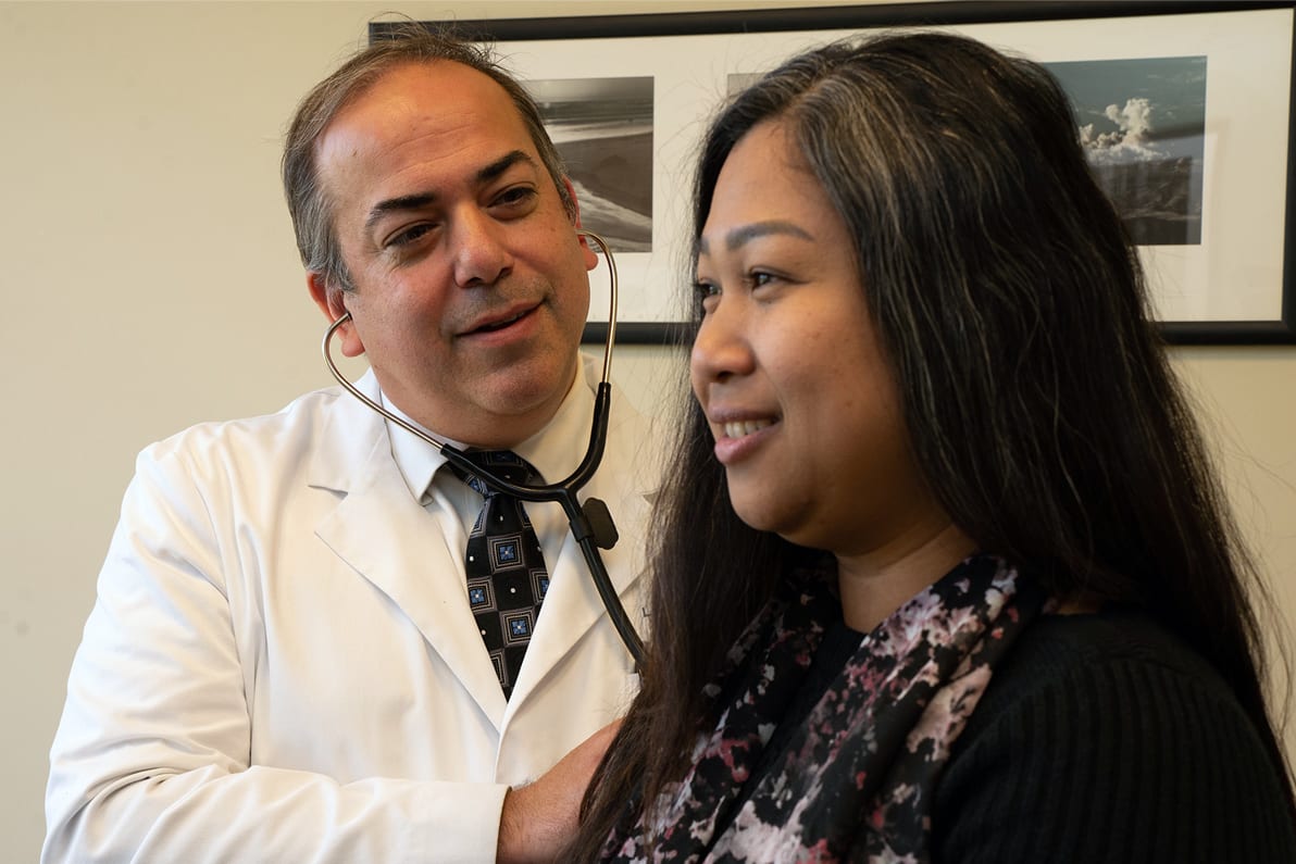 Male doctor with female patient