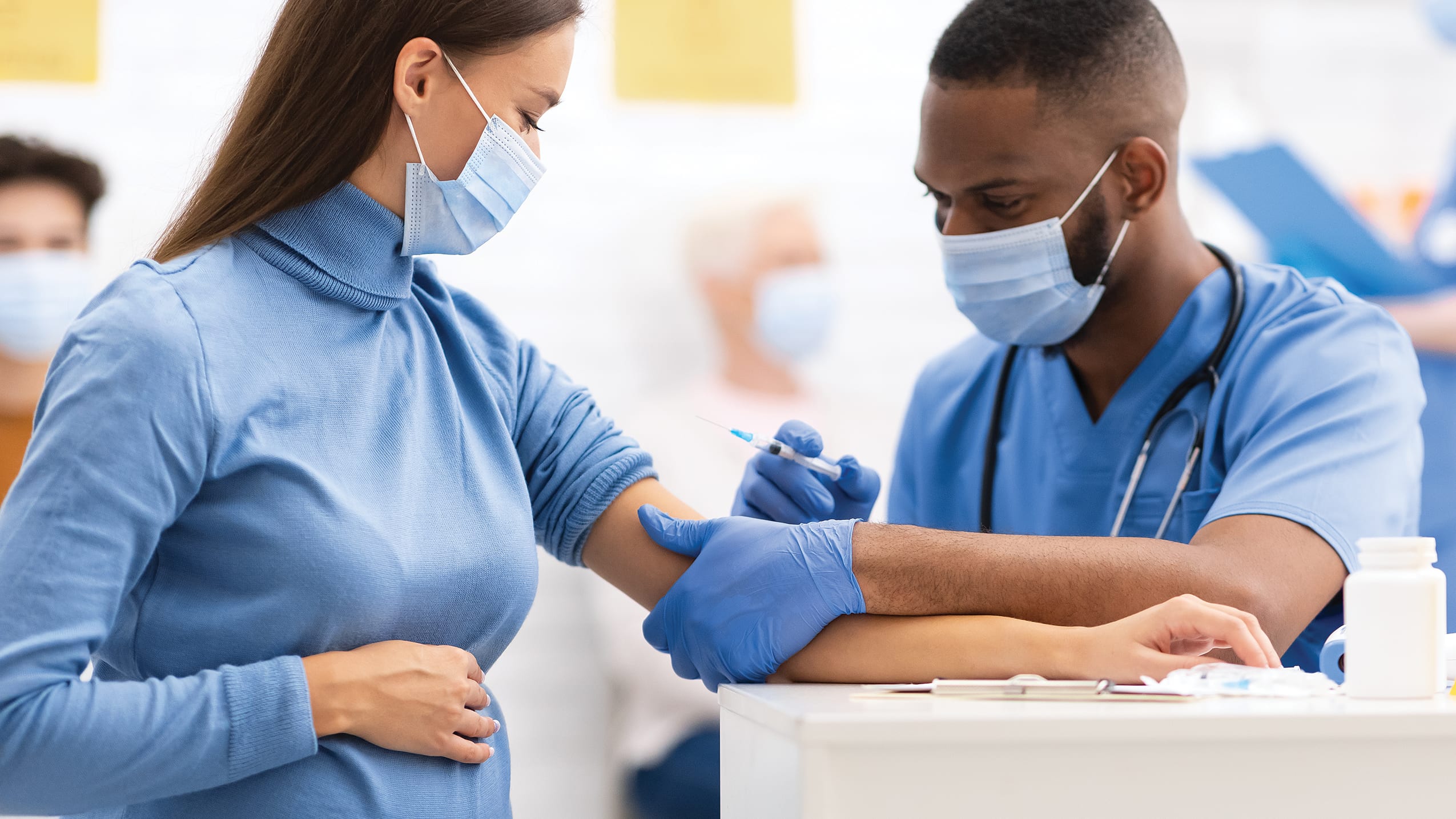 Pregnant woman getting vaccine