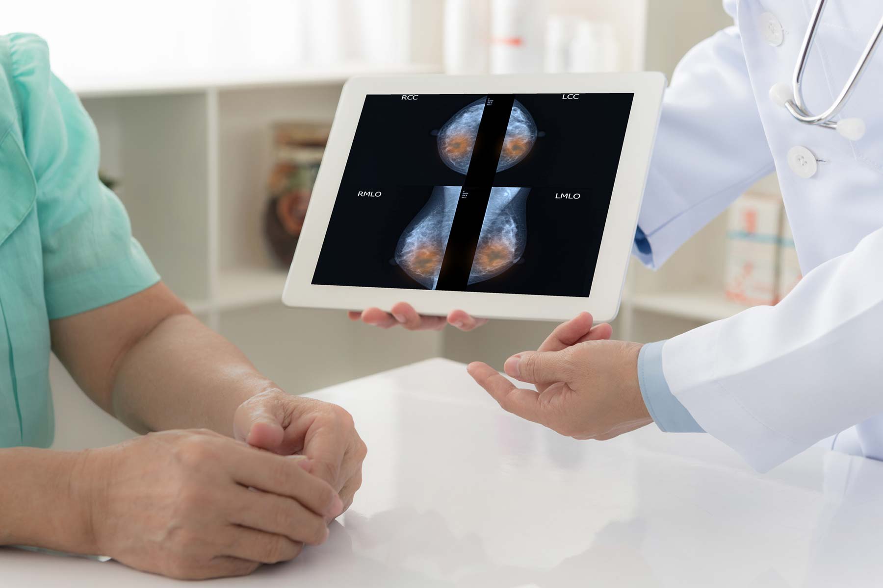 Breast Health - provider looking at images on ipad