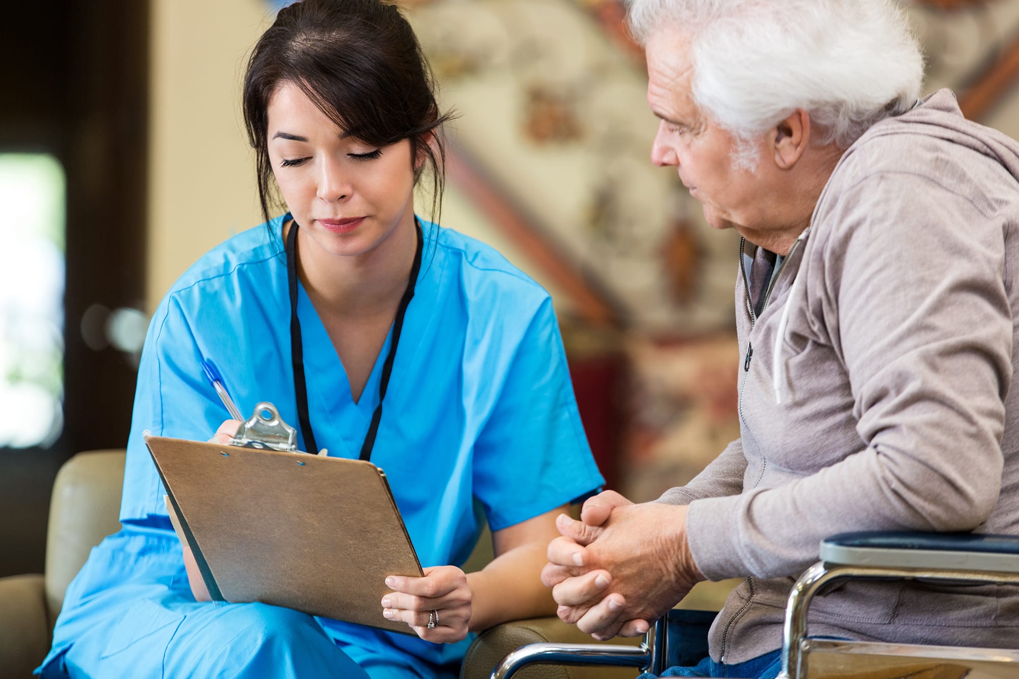 Female provider talking with male patient