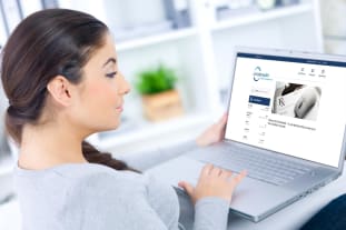 Woman viewing Patient Portal on laptop