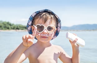 July is UV Safety Month - kid at beach
