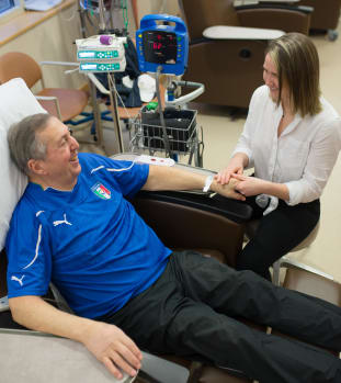 Cancer patient getting hand therapy