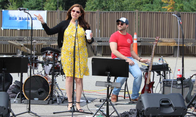 band with Lowell General employee Alex Michaels of the Physical Therapy department