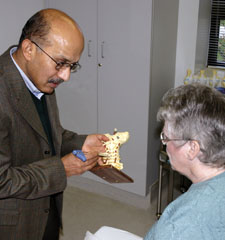 G.K. Dwarakanath, MD, with a patient in the Pain Management Center at Lowell General Hospital