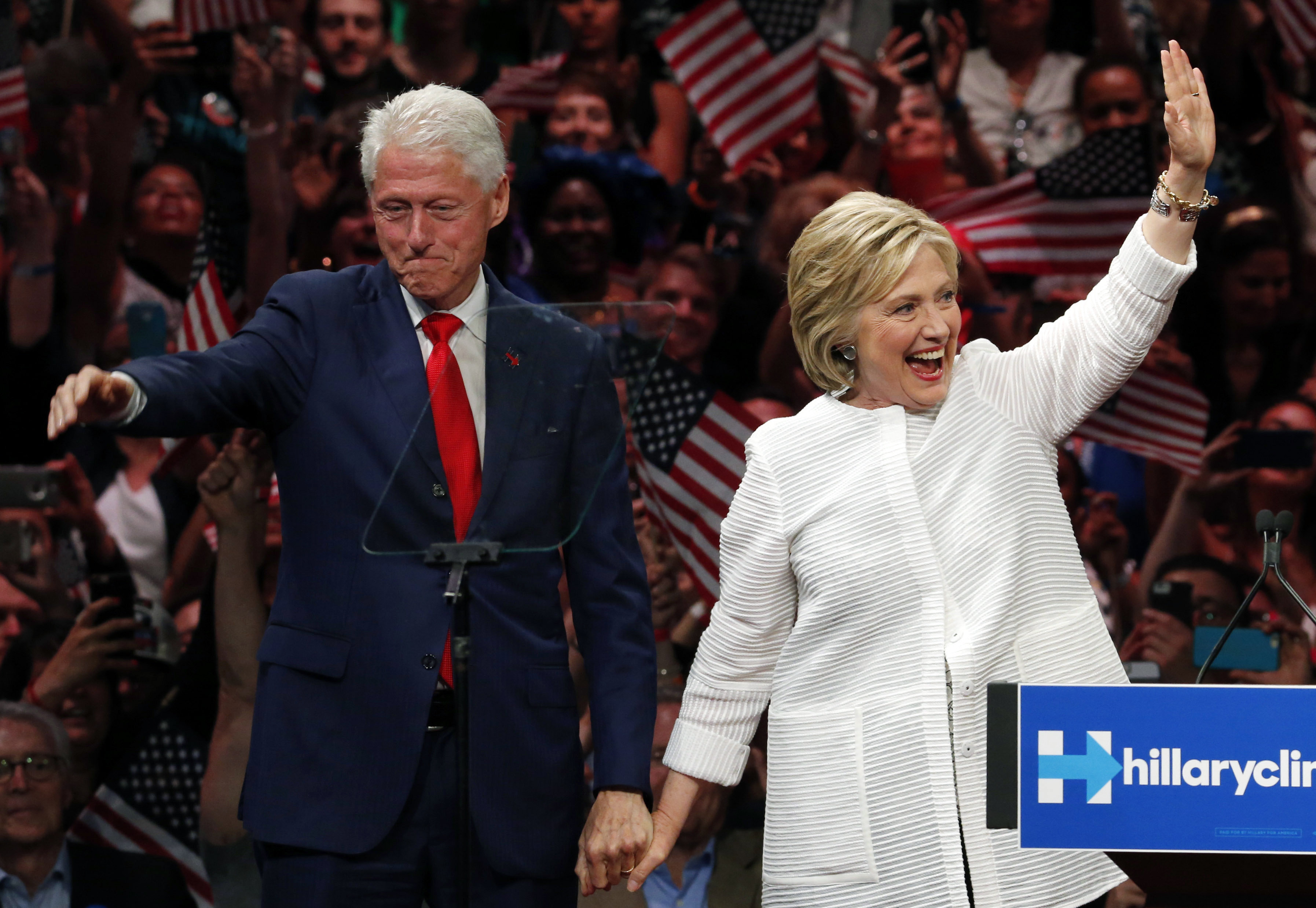 Former President Bill Clinton stands on stage with his wife, Democratic presidential candidate Hillary Clinton.