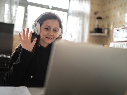 Girl at computer for remote learning.