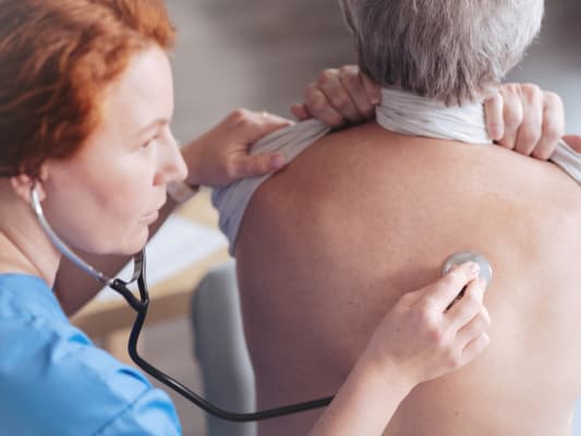 Nurse with stethoscope and lungs