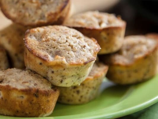 Apple cinnamon muffins on green plate.