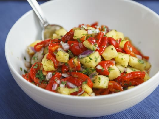 A small bowl of roasted red pepper and pineapple salsa ready to serve.