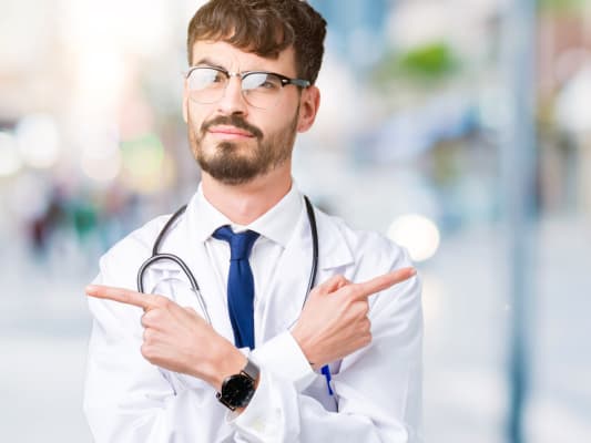 Dr pointing two directions