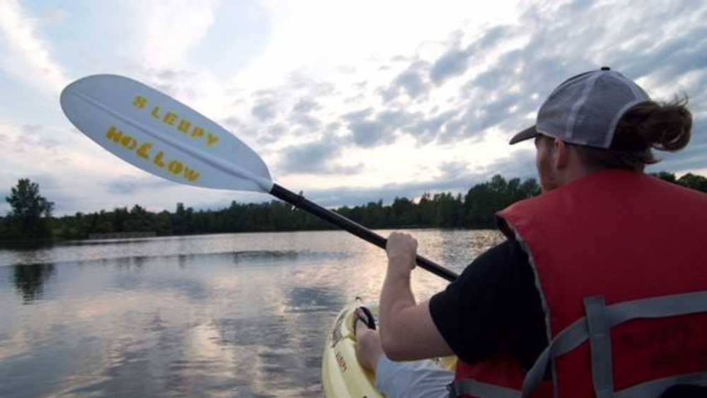 Kayaker on Lake Ovid Kayaker on Lake Ovid