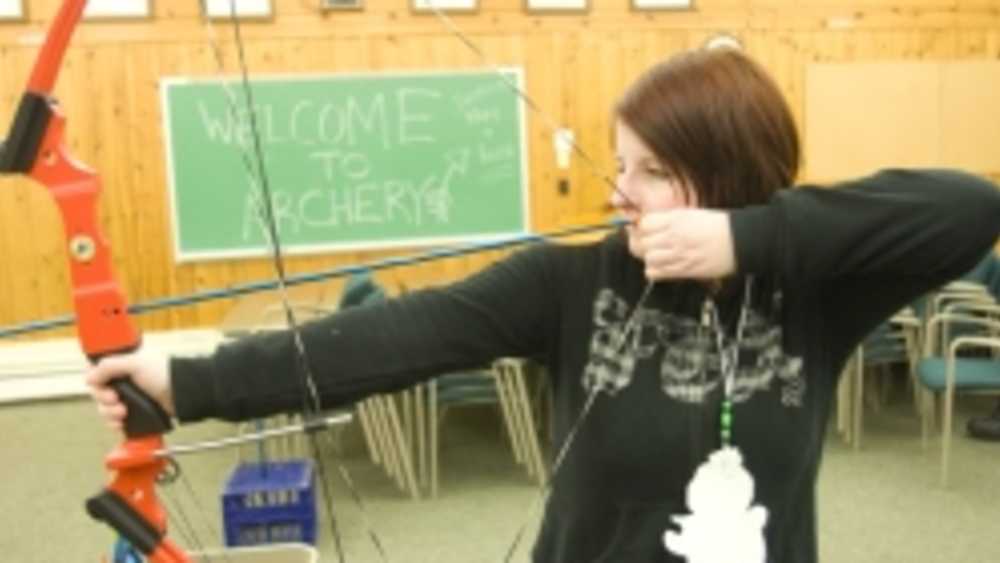 woman shooting bow woman shooting bow
