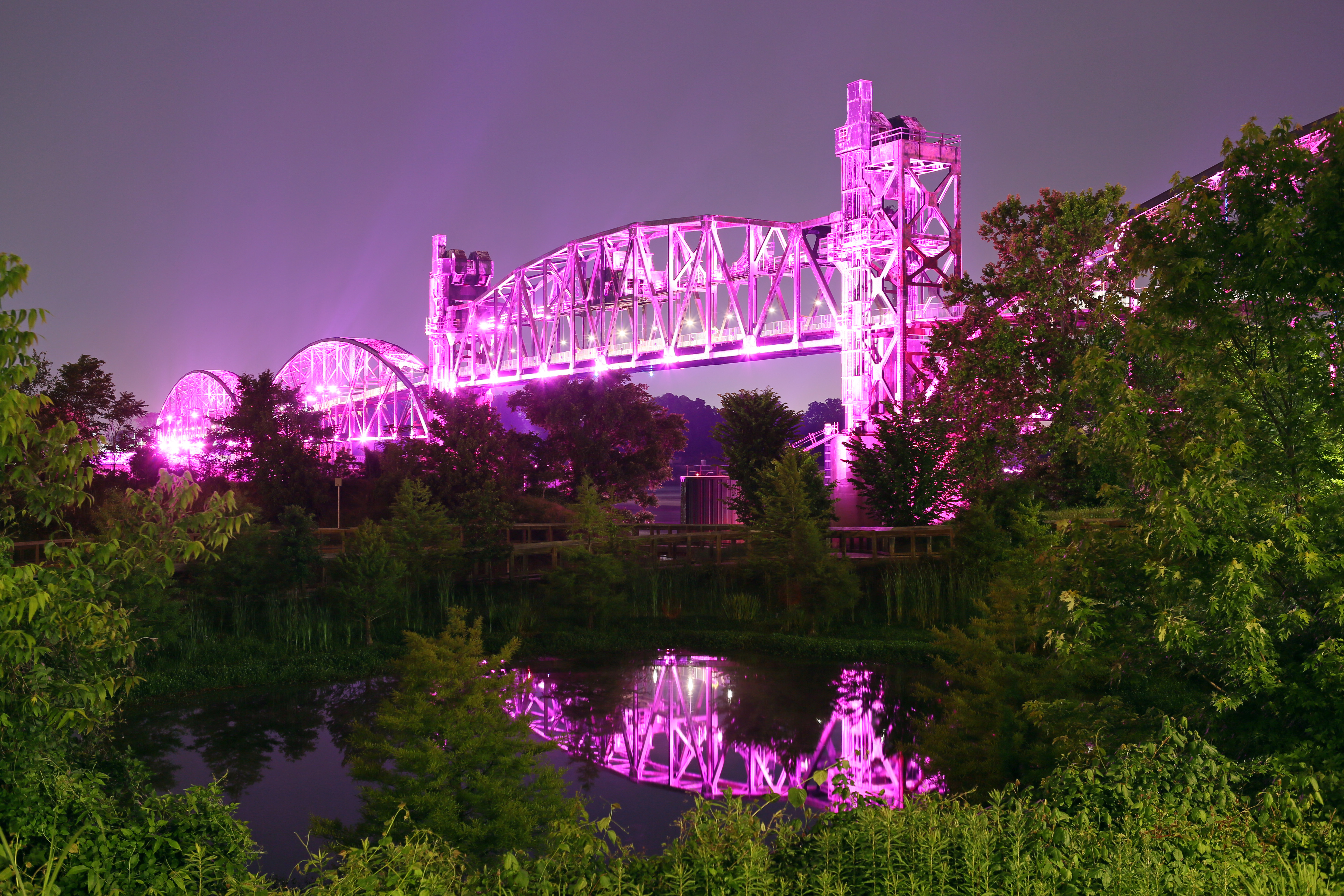 The Clinton Presidential Park Bridge glows at night